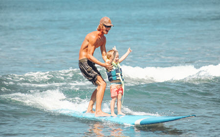 Girl Riding A Maui Wave