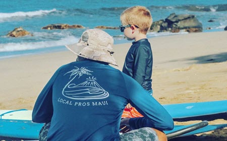 Boy WIth Surf Instructor