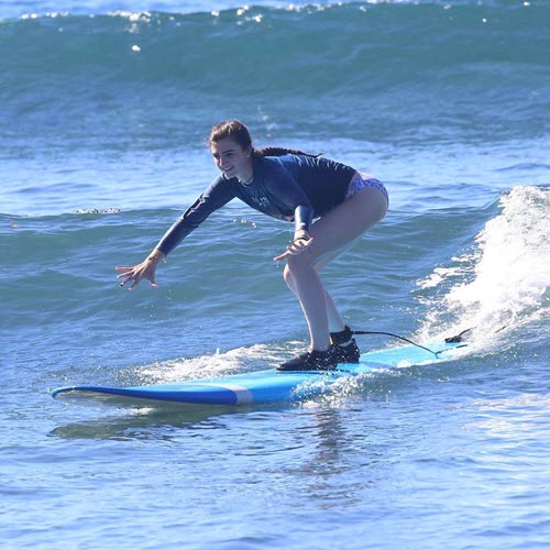 Lady Using Surfboard Leash